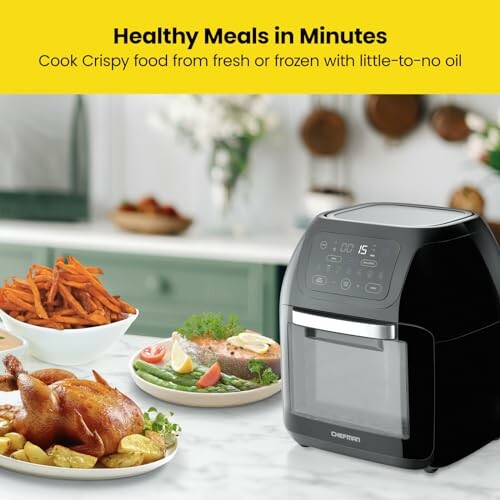 Air fryer with cooked food on kitchen counter