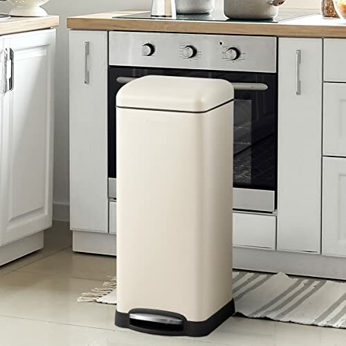 Beige trash can in a modern kitchen