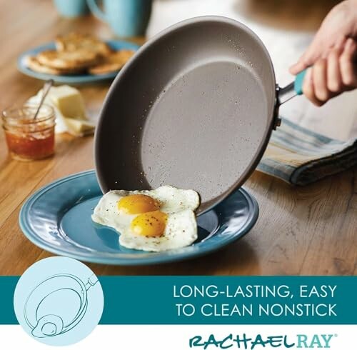 Nonstick pan with fried eggs being served onto a plate.