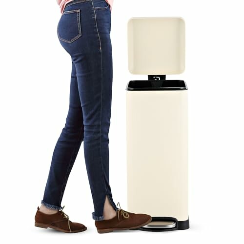 Person using a hands-free trash can with foot pedal