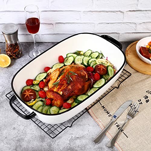 Roast chicken with vegetables in a baking dish on a table.